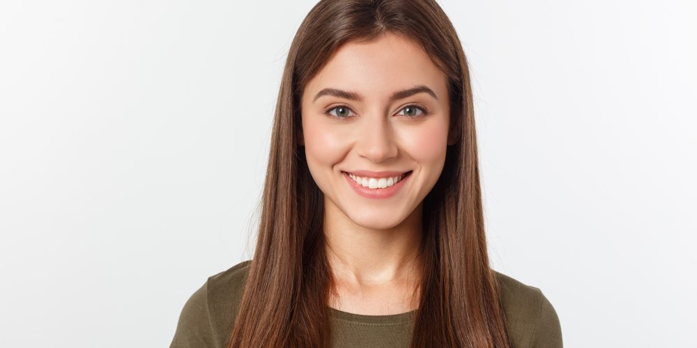 Close-up,Portrait,Of,Yong,Woman,Casual,Portrait,In,Positive,View, general dentistry in brentwood