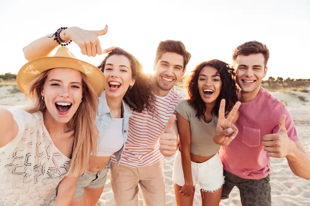 Group of friends smiling confidently with healthy teeth in Brentwood, CA