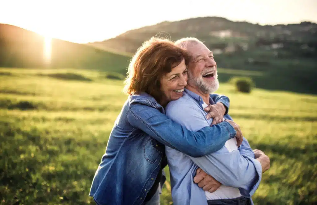 Happy senior couple enjoying healthy smiles and personalized Tooth-Colored Fillings